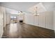 Spacious living room with hardwood floors, ceiling fan, and corner fireplace at 9450 N 94Th Pl # 214, Scottsdale, AZ 85258
