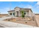 Charming single-story home featuring a desert landscape, neutral paint, and a tile roof at 10035 S Palo Verde Dr, Apache Junction, AZ 85120