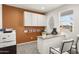 Modern office with built-in cabinets, sleek desk, and a view from the bright window at 10035 S Palo Verde Dr, Apache Junction, AZ 85120