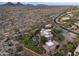 Stunning desert home featuring a pool, putting green, and beautiful mountain views at 10092 E Troon North Dr, Scottsdale, AZ 85262