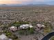 Desert home with a putting green offers stunning views of the surrounding landscape at 10092 E Troon North Dr, Scottsdale, AZ 85262