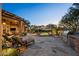 Beautiful backyard with covered patio, outdoor kitchen, inground pool, and desert landscaping at 10092 E Troon North Dr, Scottsdale, AZ 85262