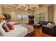 Bedroom features two beds, a seating area, recessed lighting, and scenic views at 10092 E Troon North Dr, Scottsdale, AZ 85262