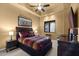 Inviting bedroom featuring dark wood furniture and warm lighting, creating a relaxing and cozy atmosphere at 10092 E Troon North Dr, Scottsdale, AZ 85262