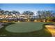 Backyard putting green with manicured grass and desert landscaping, perfect for outdoor recreation at 10092 E Troon North Dr, Scottsdale, AZ 85262