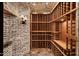 A custom wine cellar provides ample storage in a cool environment at 10092 E Troon North Dr, Scottsdale, AZ 85262