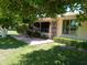 Secluded backyard with patio, lush landscaping, and serene setting for relaxation at 10229 W Bolivar Dr, Sun City, AZ 85351