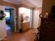 Bathroom view leading to bedroom featuring vanity, mirror, and interior closet at 10229 W Bolivar Dr, Sun City, AZ 85351