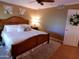 Well-lit bedroom featuring a comfortable bed, ceiling fan, and tasteful decor at 10229 W Bolivar Dr, Sun City, AZ 85351