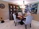 Charming dining area with a round table, upholstered chairs, and decorative hutch at 10229 W Bolivar Dr, Sun City, AZ 85351