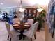 Cozy dining area with a round table, elegant chairs, and stylish decorative accents at 10229 W Bolivar Dr, Sun City, AZ 85351