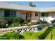 Home featuring a charming garden, complemented by a secure home security system and mature landscaping at 10229 W Bolivar Dr, Sun City, AZ 85351