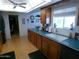 Well-lit kitchen with ample counter space, wood cabinetry, and a large window at 10229 W Bolivar Dr, Sun City, AZ 85351