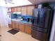 Functional kitchen featuring stainless steel appliances, ample cabinet space, and a ceiling fan at 10229 W Bolivar Dr, Sun City, AZ 85351