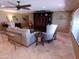 Comfortable living room with a ceiling fan, neutral color scheme, and stylish furniture at 10229 W Bolivar Dr, Sun City, AZ 85351