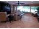 Open living room area featuring comfortable seating and views of the outdoors at 10229 W Bolivar Dr, Sun City, AZ 85351