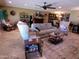 Spacious living room featuring comfortable seating, a fireplace, and elegant decor, perfect for relaxation at 10229 W Bolivar Dr, Sun City, AZ 85351