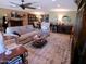 Spacious living room with a ceiling fan, neutral-colored furniture, and elegant decor at 10229 W Bolivar Dr, Sun City, AZ 85351