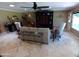 Spacious living area boasts a large sofa, classic furnishings, and tile flooring at 10229 W Bolivar Dr, Sun City, AZ 85351