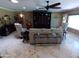 Open living room features a built-in entertainment center, comfortable seating, and natural light at 10229 W Bolivar Dr, Sun City, AZ 85351