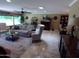 Inviting living room with cozy seating, fireplace, and lots of natural light at 10229 W Bolivar Dr, Sun City, AZ 85351