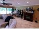 Inviting living room with a fireplace, cozy seating, and bright natural light at 10229 W Bolivar Dr, Sun City, AZ 85351
