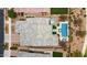Aerial view showcasing a private backyard with a swimming pool, hot tub, and lush greenery at 10631 E Tallahassee Ave, Mesa, AZ 85212