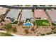 Aerial view of a suburban home featuring a private pool, putting green, and landscaped backyard in a residential neighborhood at 10631 E Tallahassee Ave, Mesa, AZ 85212