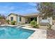 Inviting backyard with a pool, hot tub, covered patio, and lush landscaping offers a tranquil retreat at 10631 E Tallahassee Ave, Mesa, AZ 85212