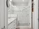 Elegant bathroom with a glass enclosed shower, tiled walls, and a granite vanity with dual sinks at 10631 E Tallahassee Ave, Mesa, AZ 85212