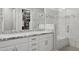 Bright bathroom with a glass walk-in shower, dual sinks, granite countertops, and a walk-in closet at 10631 E Tallahassee Ave, Mesa, AZ 85212