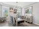 Sophisticated dining room with elegant chandelier, mirrored buffet, and six upholstered chairs at 10631 E Tallahassee Ave, Mesa, AZ 85212