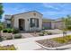 Charming home with desert landscaping, covered entry, and attached two-car garage at 10631 E Tallahassee Ave, Mesa, AZ 85212