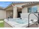 Hot tub and patio with outdoor seating, a ceiling fan and stylish lighting at 10631 E Tallahassee Ave, Mesa, AZ 85212