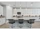 Modern kitchen featuring an island with bar seating and granite countertops at 10631 E Tallahassee Ave, Mesa, AZ 85212