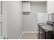 Bright laundry room with modern washer and dryer, cabinet, and ample space for convenience at 10631 E Tallahassee Ave, Mesa, AZ 85212