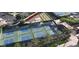 Aerial view of well-maintained pickleball courts with landscaping and shade structures at 10631 E Tallahassee Ave, Mesa, AZ 85212