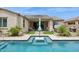 Inviting backyard pool with stepping stones, patio area, and lush landscaping perfect for outdoor relaxation at 10631 E Tallahassee Ave, Mesa, AZ 85212