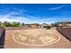 Large, private backyard with gravel and a retaining wall in a residential neighborhood at 11357 W Buchanan St, Avondale, AZ 85323