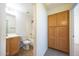 Bathroom featuring a vanity, shower-tub combo and convenient storage cabinet at 11357 W Buchanan St, Avondale, AZ 85323
