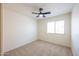 Bedroom offering neutral carpet, ceiling fan, and a window for natural light at 11357 W Buchanan St, Avondale, AZ 85323