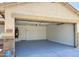 Attached two-car garage with freshly painted floor and water heater at 11357 W Buchanan St, Avondale, AZ 85323
