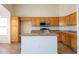 Kitchen featuring stainless steel appliances, an island and ample cabinetry for storage at 11357 W Buchanan St, Avondale, AZ 85323
