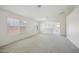 Open living area with neutral carpet and white walls, perfect for entertaining and relaxation at 11357 W Buchanan St, Avondale, AZ 85323