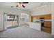 Open floorplan with kitchen, dining area, and sliding doors to outdoor patio at 11357 W Buchanan St, Avondale, AZ 85323