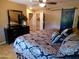 Primary bedroom featuring stylish decor, barn door accent, and tile flooring at 11415 N 110Th Dr, Sun City, AZ 85351