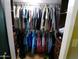 Walk-in closet featuring organized clothing racks and storage shelves at 11415 N 110Th Dr, Sun City, AZ 85351
