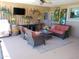 Beautiful covered outdoor living space with stylish decor and comfortable seating arrangements at 11415 N 110Th Dr, Sun City, AZ 85351