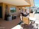 Spacious, covered back patio offers room for outdoor dining and relaxing at 11415 N 110Th Dr, Sun City, AZ 85351