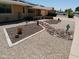 Unique desert landscaping featuring creative design elements, decorative rock and drought tolerant plants at 11415 N 110Th Dr, Sun City, AZ 85351